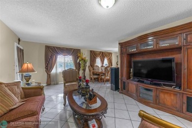 Priced to sell! Large Corner Unit! 2 bedroom/ 2 bathrooms, Lake on Flamingo Lakes Country Club in Florida - for sale on GolfHomes.com, golf home, golf lot