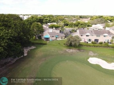 Welcome to this beautiful end unit located on the 5th green of on Woodmont Country Club in Florida - for sale on GolfHomes.com, golf home, golf lot