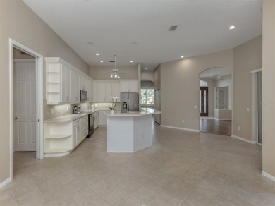 Stunning residence that's filled with natural light and on The Venice Golf and Country Club in Florida - for sale on GolfHomes.com, golf home, golf lot