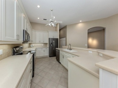 Stunning residence that's filled with natural light and on The Venice Golf and Country Club in Florida - for sale on GolfHomes.com, golf home, golf lot