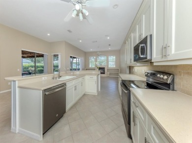 Stunning residence that's filled with natural light and on The Venice Golf and Country Club in Florida - for sale on GolfHomes.com, golf home, golf lot