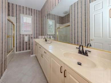 Stunning residence that's filled with natural light and on The Venice Golf and Country Club in Florida - for sale on GolfHomes.com, golf home, golf lot