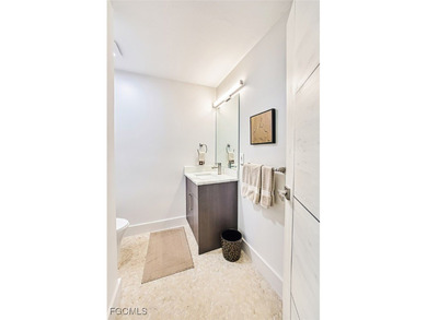 Sweeping water views will greet you when you walk into this on The Dunes Golf and Tennis Club in Florida - for sale on GolfHomes.com, golf home, golf lot