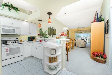 MOVE RIGHT IN to this IMMACULATE second floor unit, with a on Sabal Trace Golf and Country Club in Florida - for sale on GolfHomes.com, golf home, golf lot