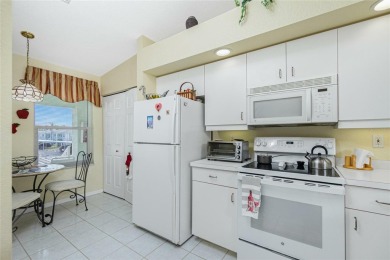 MOVE RIGHT IN to this IMMACULATE second floor unit, with a on Sabal Trace Golf and Country Club in Florida - for sale on GolfHomes.com, golf home, golf lot