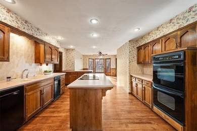 Nestled along the 16th hole at the Country Club of Leawood, this on Leawood South Country Club in Kansas - for sale on GolfHomes.com, golf home, golf lot