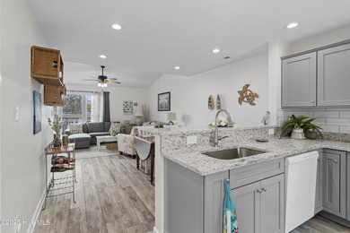 Welcome home to 7212 Windward Drive inside of the immaculate on Harbour Point Golf Club in North Carolina - for sale on GolfHomes.com, golf home, golf lot