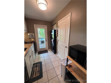 The 2 bed/2bath home with lake view is just what you are looking on The Oaks Golf Course in Missouri - for sale on GolfHomes.com, golf home, golf lot