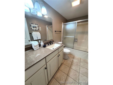 The 2 bed/2bath home with lake view is just what you are looking on The Oaks Golf Course in Missouri - for sale on GolfHomes.com, golf home, golf lot