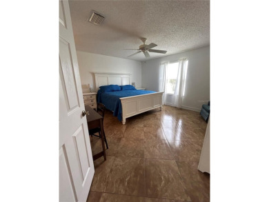 This 2-bedroom, 2-bath Austin Model home is located in the on Glenview Championship Golf and Country Club in Florida - for sale on GolfHomes.com, golf home, golf lot