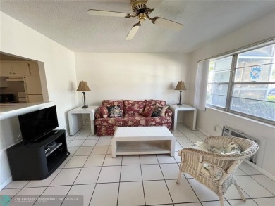 ENJOY THE CONVENIENCE OF FIRST FLOOR LIVING IN THIS ONE BEDROOM on Hillsboro Pines Golf in Florida - for sale on GolfHomes.com, golf home, golf lot