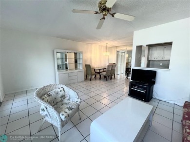 ENJOY THE CONVENIENCE OF FIRST FLOOR LIVING IN THIS ONE BEDROOM on Hillsboro Pines Golf in Florida - for sale on GolfHomes.com, golf home, golf lot