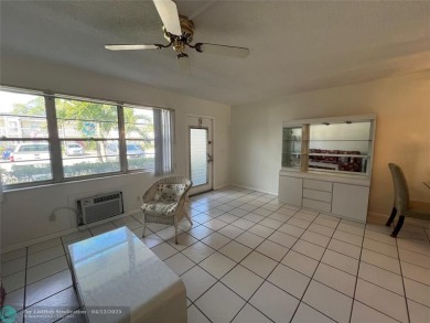 ENJOY THE CONVENIENCE OF FIRST FLOOR LIVING IN THIS ONE BEDROOM on Hillsboro Pines Golf in Florida - for sale on GolfHomes.com, golf home, golf lot