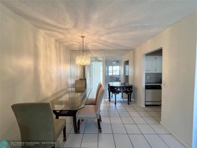 ENJOY THE CONVENIENCE OF FIRST FLOOR LIVING IN THIS ONE BEDROOM on Hillsboro Pines Golf in Florida - for sale on GolfHomes.com, golf home, golf lot