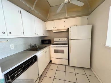 ENJOY THE CONVENIENCE OF FIRST FLOOR LIVING IN THIS ONE BEDROOM on Hillsboro Pines Golf in Florida - for sale on GolfHomes.com, golf home, golf lot