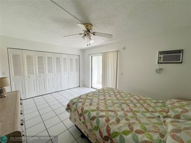 ENJOY THE CONVENIENCE OF FIRST FLOOR LIVING IN THIS ONE BEDROOM on Hillsboro Pines Golf in Florida - for sale on GolfHomes.com, golf home, golf lot
