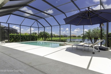 Enjoy lake views and vibrant sunsets from your gas-heated pool on Duran Golf Course in Florida - for sale on GolfHomes.com, golf home, golf lot