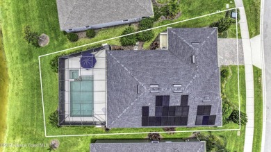 Enjoy lake views and vibrant sunsets from your gas-heated pool on Duran Golf Course in Florida - for sale on GolfHomes.com, golf home, golf lot