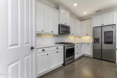 Enjoy lake views and vibrant sunsets from your gas-heated pool on Duran Golf Course in Florida - for sale on GolfHomes.com, golf home, golf lot