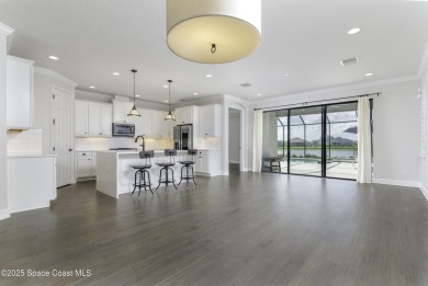 Enjoy lake views and vibrant sunsets from your gas-heated pool on Duran Golf Course in Florida - for sale on GolfHomes.com, golf home, golf lot