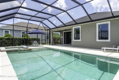Enjoy lake views and vibrant sunsets from your gas-heated pool on Duran Golf Course in Florida - for sale on GolfHomes.com, golf home, golf lot