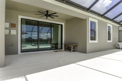 Enjoy lake views and vibrant sunsets from your gas-heated pool on Duran Golf Course in Florida - for sale on GolfHomes.com, golf home, golf lot