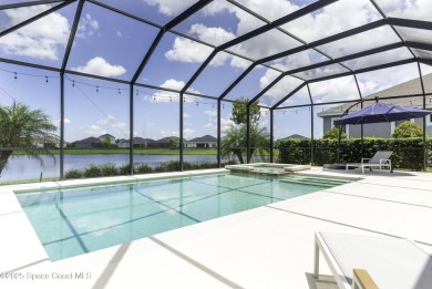 Enjoy lake views and vibrant sunsets from your gas-heated pool on Duran Golf Course in Florida - for sale on GolfHomes.com, golf home, golf lot