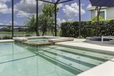 Enjoy lake views and vibrant sunsets from your gas-heated pool on Duran Golf Course in Florida - for sale on GolfHomes.com, golf home, golf lot