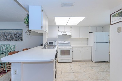 Experience serene living in this beautifully maintained on Village Golf Club in Florida - for sale on GolfHomes.com, golf home, golf lot