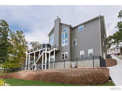 Not only will you get this spectacular home, but the lot next on Raintree Country Club in Missouri - for sale on GolfHomes.com, golf home, golf lot