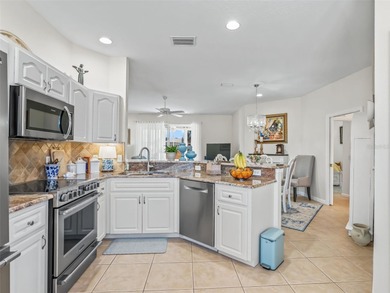 Fabulous Golf Course home with a GOLF CART GARAGE! Welcome to on Ocala Palms Golf and Country Club in Florida - for sale on GolfHomes.com, golf home, golf lot