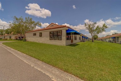 Welcome home to this light and airy 2 bedroom/2 bathroom corner on Mainlands Golf Club in Florida - for sale on GolfHomes.com, golf home, golf lot