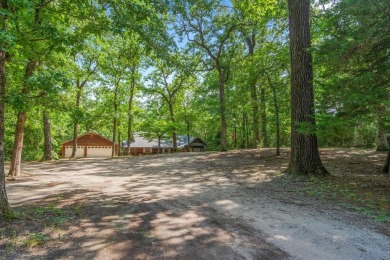 Secluded 3 bedroom 2 bath home surrounded on all 4 sides by on Holly Lake Ranch Golf Club in Texas - for sale on GolfHomes.com, golf home, golf lot