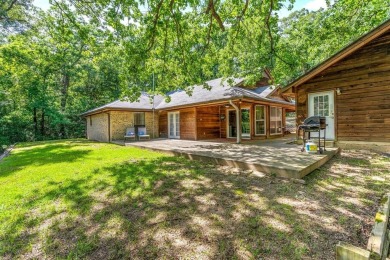 Secluded 3 bedroom 2 bath home surrounded on all 4 sides by on Holly Lake Ranch Golf Club in Texas - for sale on GolfHomes.com, golf home, golf lot