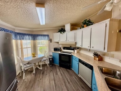Home is located in Water Oak Country Club Estates in Lady Lake on Water Oak Country Club Estates in Florida - for sale on GolfHomes.com, golf home, golf lot