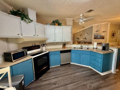 Home is located in Water Oak Country Club Estates in Lady Lake on Water Oak Country Club Estates in Florida - for sale on GolfHomes.com, golf home, golf lot