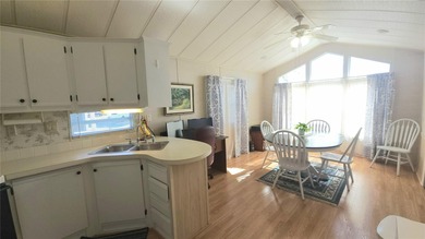 CHEERFUL HOME IN ACTIVE 55+ COMMUNITY! This one bed, 1 1/2 bath on River Run Golf Links in Florida - for sale on GolfHomes.com, golf home, golf lot