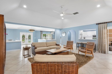 Discover comfortable luxury in this expansive single-story on Atlantis Golf Club in Florida - for sale on GolfHomes.com, golf home, golf lot