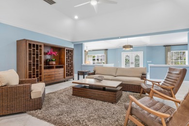 Discover comfortable luxury in this expansive single-story on Atlantis Golf Club in Florida - for sale on GolfHomes.com, golf home, golf lot