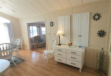 CHEERFUL HOME IN ACTIVE 55+ COMMUNITY! This one bed, 1 1/2 bath on River Run Golf Links in Florida - for sale on GolfHomes.com, golf home, golf lot