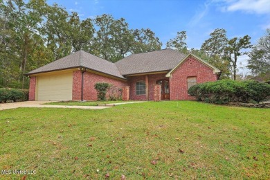 This immaculate 3-bedroom, 2-bathroom home boasts a spacious 1 on Castlewoods Golf Club in Mississippi - for sale on GolfHomes.com, golf home, golf lot