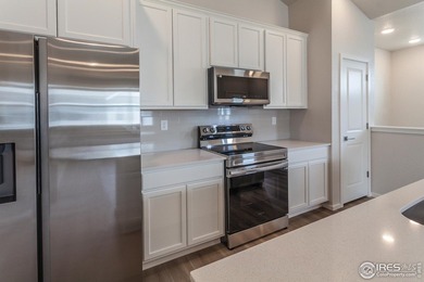 Lock-and-leave living at its best! Move-in ready and designed on Raindance National Golf Course in Colorado - for sale on GolfHomes.com, golf home, golf lot