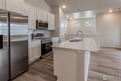 Lock-and-leave living at its best! Move-in ready and designed on Raindance National Golf Course in Colorado - for sale on GolfHomes.com, golf home, golf lot