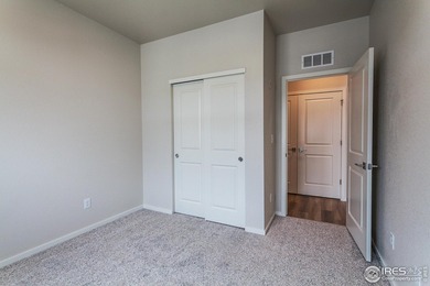 Lock-and-leave living at its best! Move-in ready and designed on Raindance National Golf Course in Colorado - for sale on GolfHomes.com, golf home, golf lot