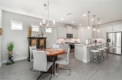 This Delray model from the Traditional Series features a tile on Herons Glen Golf and Country Club in Florida - for sale on GolfHomes.com, golf home, golf lot