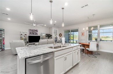 This Delray model from the Traditional Series features a tile on Herons Glen Golf and Country Club in Florida - for sale on GolfHomes.com, golf home, golf lot