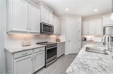 This Delray model from the Traditional Series features a tile on Herons Glen Golf and Country Club in Florida - for sale on GolfHomes.com, golf home, golf lot