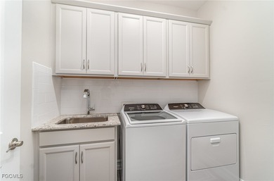 This Delray model from the Traditional Series features a tile on Herons Glen Golf and Country Club in Florida - for sale on GolfHomes.com, golf home, golf lot