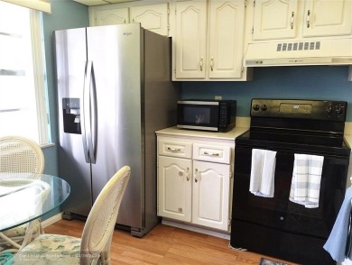 LOVELY 2ND STORY, CORNER 2BR/2BTH CONDO IN THE PEACEFUL BAHAMA on Wynmoor Golf Course in Florida - for sale on GolfHomes.com, golf home, golf lot