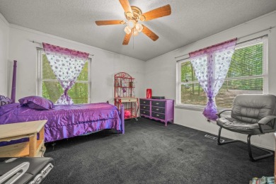 Nestled in a peaceful, wooded setting of Diamondhead Golf & on Diamondhead Golf and Country Club in Arkansas - for sale on GolfHomes.com, golf home, golf lot